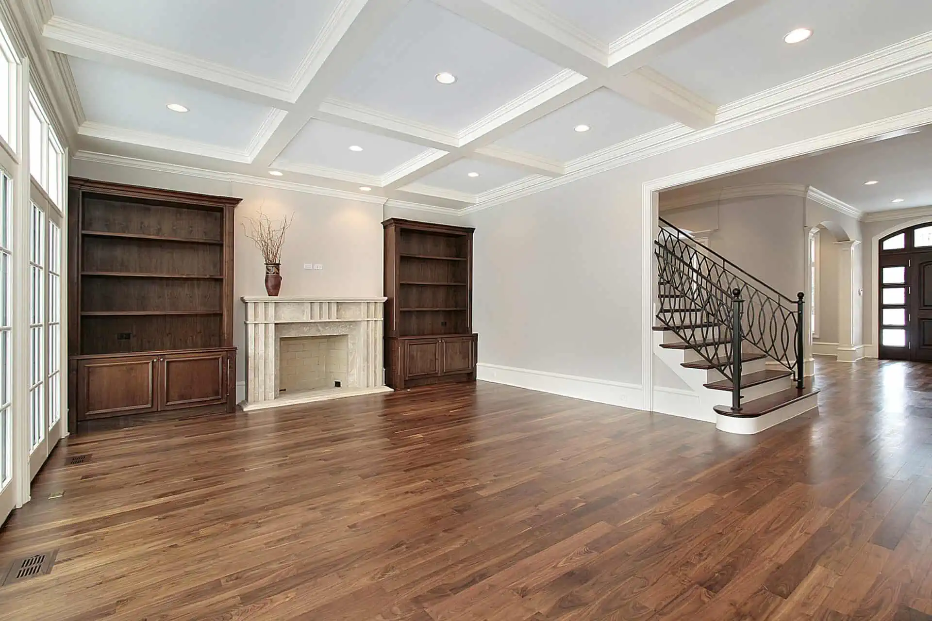 Family room in new construction home with cherry floors